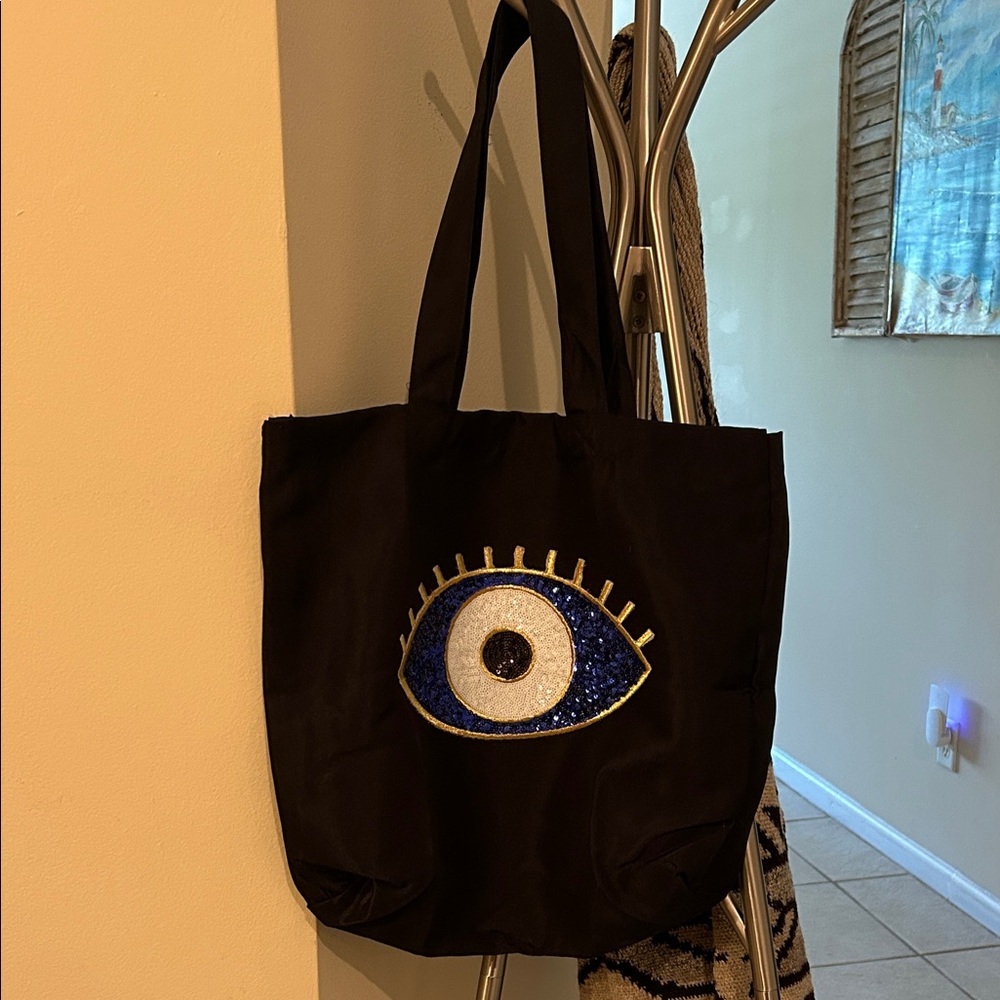 Elegant Black Tote with Eye Design